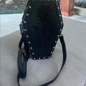 Coffin, backpack, and Crossbody